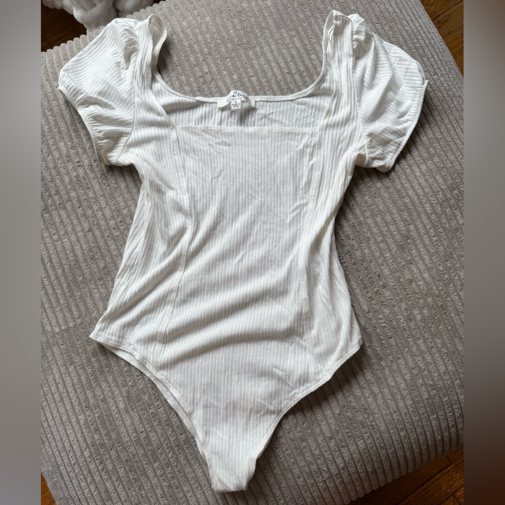 Elegant White Ribbed Bodysuit